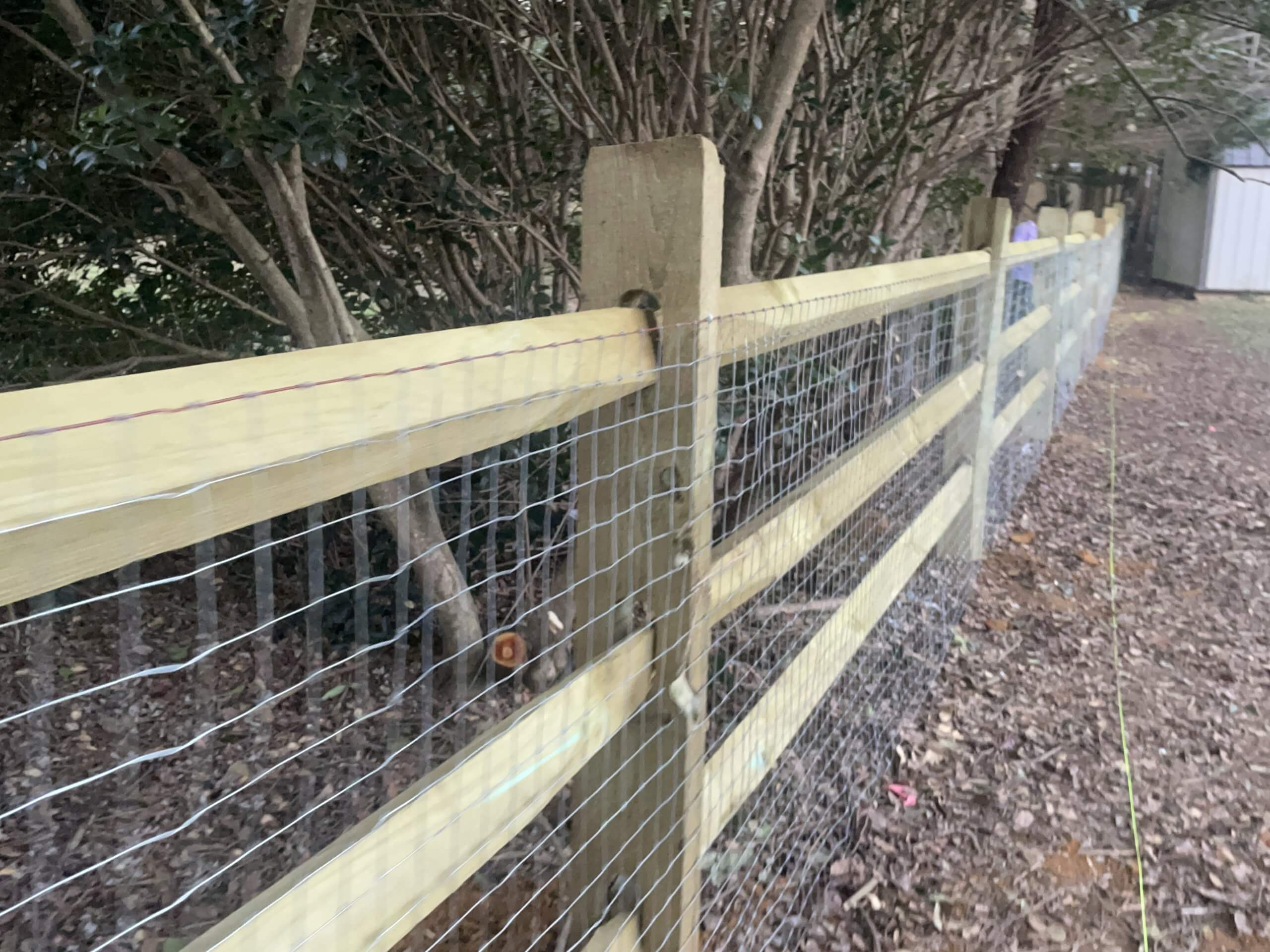 Split rails fencing with chicken wire | Fence company near me | Black Label fence, LLC