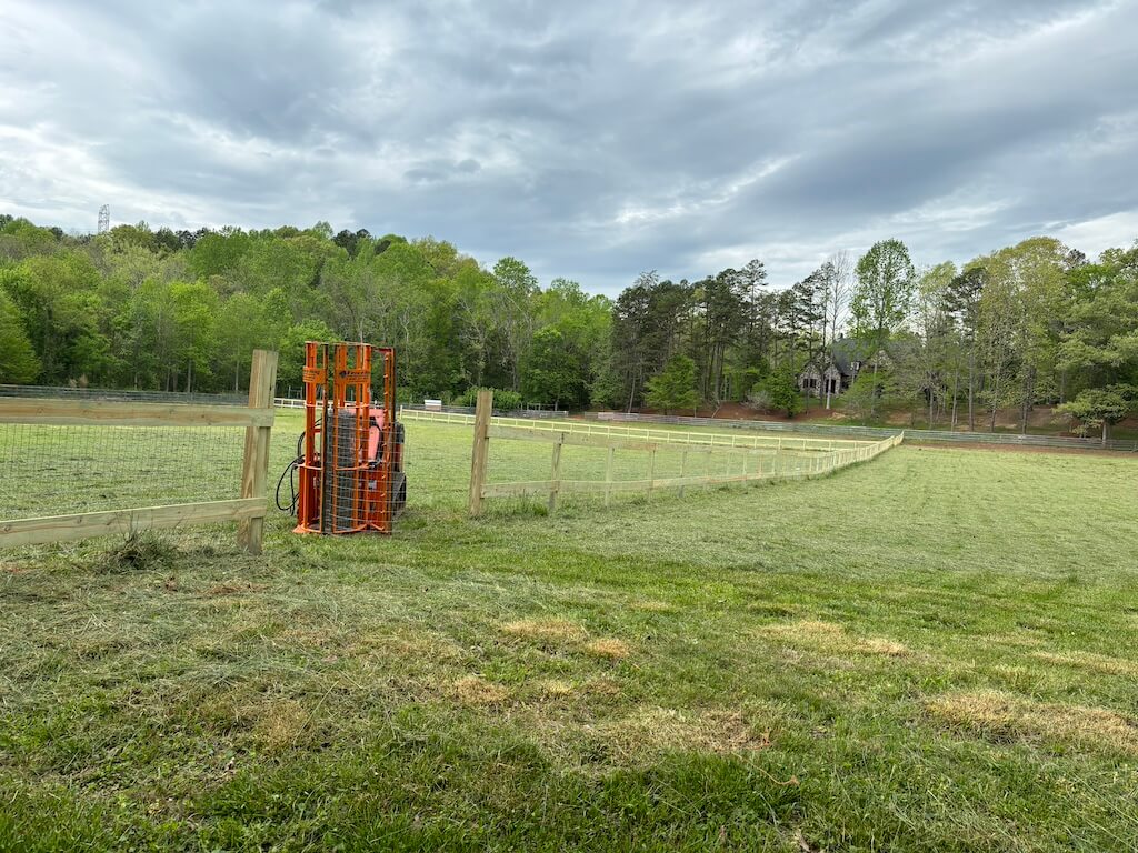 stretching field fence wire with a ditch witch