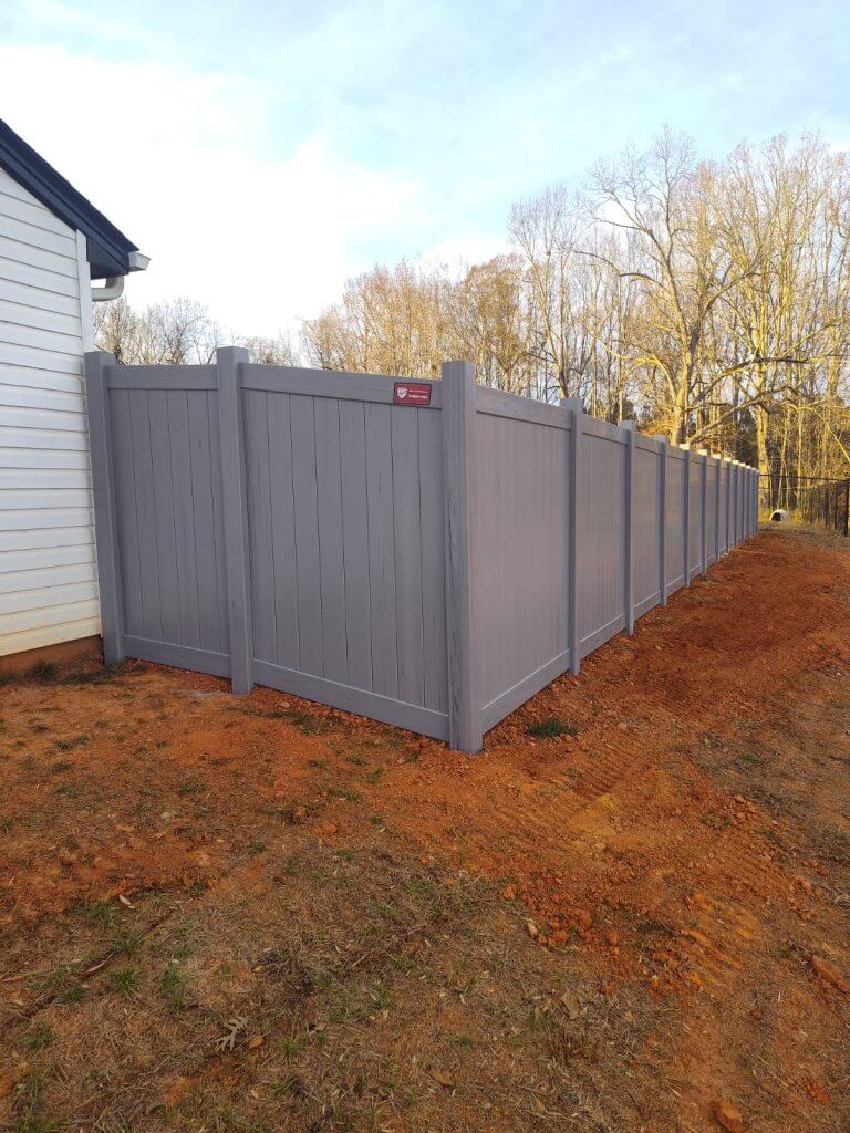 Gray Vinyl Privacy Fence installation by Black Label Fence, LLC