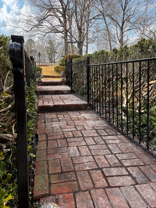 rough Iron Handrails installation by Black Label Fence, LLC