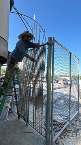 privacy slats Fence installation at Golden corral Asheboro, NC.
