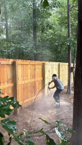 Fence staining and seal application Gastonia Fence Company.