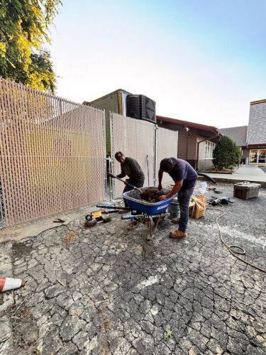 8' high chain link tan privacy slats on gates- Golden corral Asheboro