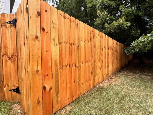 Fence staining and seal application Gastonia Fence Company.